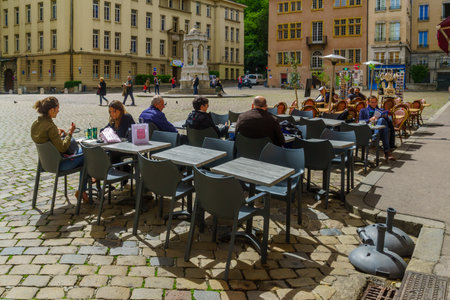Lyon, France - May 09, 2019: Street and cafe scene, with locals and visitors, in Old Lyon, Franceのeditorial素材