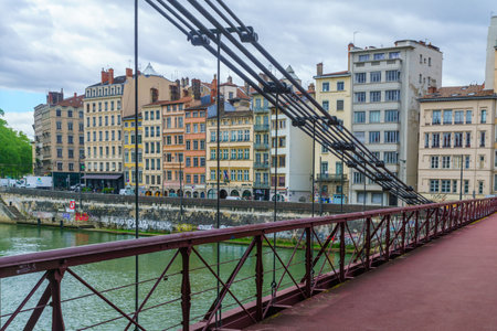 Lyon, France - May 09, 2019: The Saint-Vincent bridge, over the Saone river, and colorful houses, in Lyon, Franceのeditorial素材