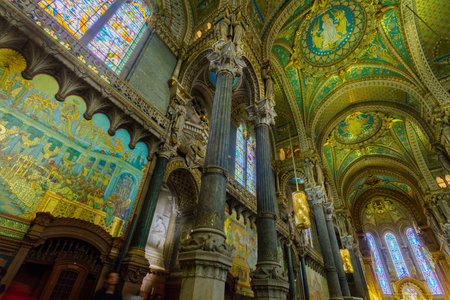 Lyon, France - May 08, 2019: The interior of Notre-Dame basilica, with visitors, in Old Lyon, France