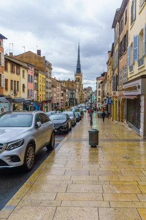 Villefranche-sur-Saone, France - May 04, 2019: Scene of main street and the church of Notre-Dame des Marais, with locals and visitors, in Villefranche-sur-Saone, Beaujolais, Rhone department, Franceのeditorial素材