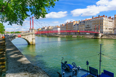 Lyon, France - May 10, 2019: The Saone River, and Saint-Gorges bridge, with locals and visitors, in Old Lyon, Franceのeditorial素材