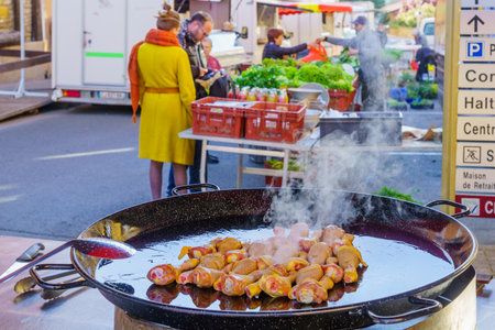 Le-Bois-de-Oingt, France - May 07, 2019: French market scene with sellers and shoppers in Le-Bois-de-Oingt, Beaujolais, Rhone department, Franceのeditorial素材