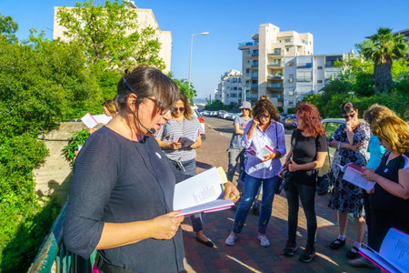 Haifa, Israel - May 19, 2019: People take part in a local walk in Neve Shaanan neighborhood, as part of Jane Walks festival, Haifa, Israelのeditorial素材