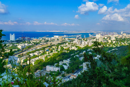Haifa, Israel - June 13, 2019: View of the downtown and the harbor, with various businesses, in...