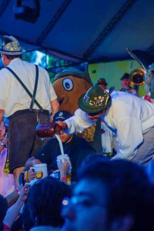 Villa General Belgrano - October 04, 2009: pouring free beer at Oktoberfest festival in Villa General Belgrano, Cordoba, Argentina. Oktoberfest is annually beer festival in German communities