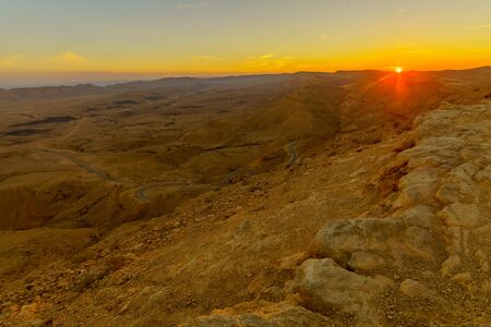 Sunset view of HaMakhtesh HaGadol (the big crater), in the Negev Desert, Southern Israel. It is a geological landform of a large erosion cirqueの写真素材
