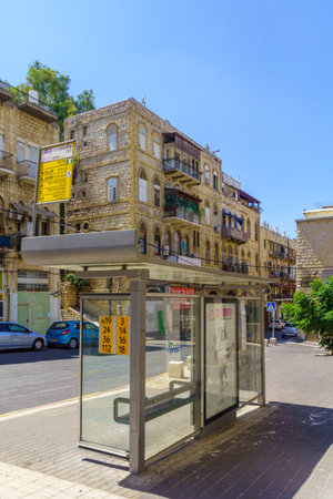 Haifa, Israel - August 22, 2019: View of bus stop and old-style buildings, in downtown Haifa, Israelのeditorial素材