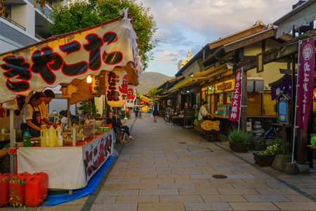 Matsumoto, Japan - October 1, 2019: View of food stalls, in the historic Nakamachi district, with locals and visitors, as part of the Yohashira Shrine Shinto Festival, in Matsumoto, Japanのeditorial素材