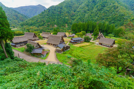 Suganuma, Japan - October 3, 2019: View of Suganuma village with traditional gassho-zukuri farmhouses, locals and visitors, in Gokayama, Nanto, Japanのeditorial素材