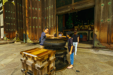 Nara, Japan - October 5, 2019: Visitors light candles in front of the Todaiji Buddhist temple, in Nara, Japanのeditorial素材