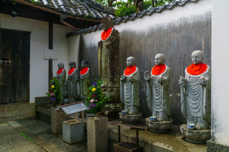 Yuasa, Japan - October 6, 2019: Buddha statue dressed in red in the Jinsenji Temple, in Yuasa, Wakayama Prefecture, Japanのeditorial素材