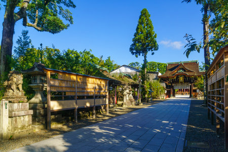 Kyoto, Japan - October 9, 2019: View of the Romon Gate of the Kitano-Temmangu Shrine, with a visitor, in Kyoto, Japanのeditorial素材