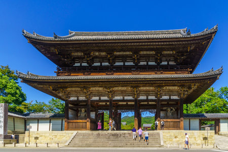 Kyoto, Japan - October 9, 2019: View of the Niomon (the Gate with a Pair of Kongo Rikishi Statues) of the Ninna-ji Temple, with visitors, in Kyoto, Japanのeditorial素材