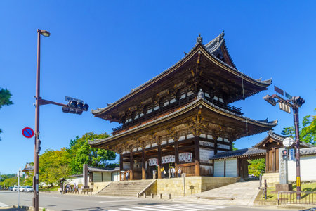 Kyoto, Japan - October 9, 2019: View of the Niomon (the Gate with a Pair of Kongo Rikishi Statues) of the Ninna-ji Temple, with visitors, in Kyoto, Japanのeditorial素材