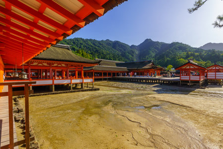 Miyajima, Japan - October 13, 2019: View of the Itsukushima Shrine, at low tide, with visitors, in Miyajima (Itsukushima) Island, Japanのeditorial素材