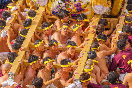 Himeji, Japan - October 14, 2019: Portable shrine carried by men in traditional dressing, and crowd. Part of the Nada no Kenka Festival, in Himeji, Japanのeditorial素材