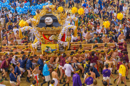 Himeji, Japan - October 14, 2019: Portable shrine carried by men in traditional dressing, and crowd. Part of the Nada no Kenka Festival, in Himeji, Japanのeditorial素材