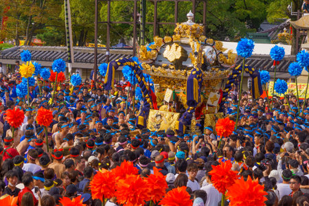 Himeji, Japan - October 14, 2019: Portable shrine carried by men in traditional dressing, and crowd. Part of the Nada no Kenka Festival, in Himeji, Japanのeditorial素材