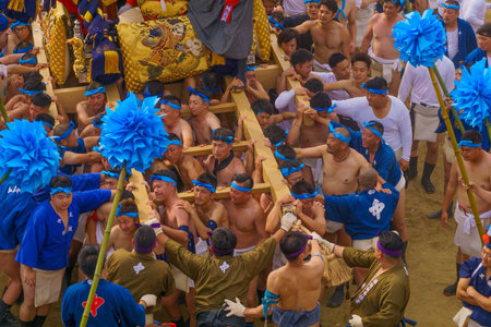 Himeji, Japan - October 14, 2019: Portable shrine carried by men in traditional dressing, and crowd. Part of the Nada no Kenka Festival, in Himeji, Japanのeditorial素材