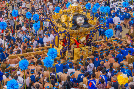 Himeji, Japan - October 14, 2019: Portable shrine carried by men in traditional dressing, and crowd. Part of the Nada no Kenka Festival, in Himeji, Japanのeditorial素材