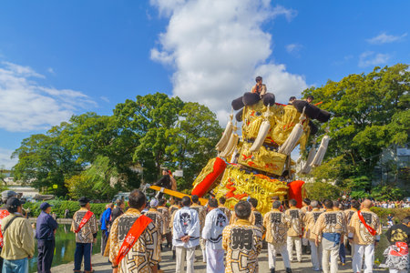 Saijo, Japan - October 16, 2019: Parade with participants carrying Mikoshi floats (portable shrines), in city center. Saijo Isono Shrine Festival, Ehime, Shikoku Island, Japanのeditorial素材