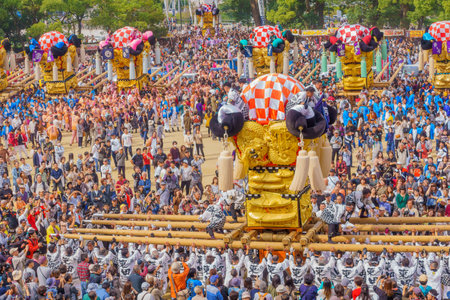 Niihama, Japan - October 17, 2019: Men in traditional clothing lifting a taikodai drum float, as part of the Niihama Taiko Festival, Ehime, Shikoku Island, Japanのeditorial素材