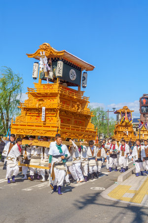 Saijo, Japan - October 16, 2019: Parade with participants carrying Danjiri floats (portable shrines), in the streets of the city center. Saijo Isono Shrine Festival, Ehime, Shikoku Island, Japanのeditorial素材