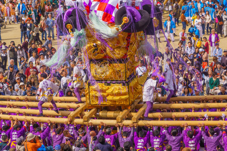 Niihama, Japan - October 17, 2019: Men in traditional clothing lifting a taikodai drum float, as part of the Niihama Taiko Festival, Ehime, Shikoku Island, Japanのeditorial素材
