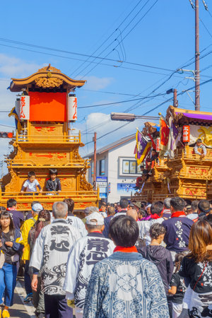 Saijo, Japan - October 16, 2019: Parade with participants carrying Danjiri floats (portable shrines), in the streets of the city center. Saijo Isono Shrine Festival, Ehime, Shikoku Island, Japanのeditorial素材