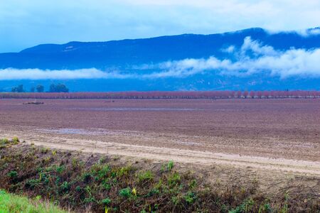 View of countryside and landscape in the north part of the Jordan river valley, on a winter day. Northern Israelの写真素材