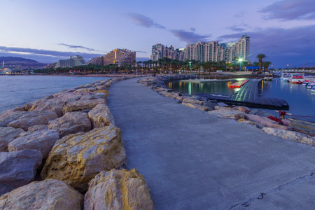 Eilat, Israel - January 17, 2020: Evening scene of the new marina and hotels, with locals and...