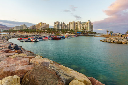 Eilat, Israel - January 17, 2020: Sunset scene of the new marina and hotels, with locals and visitors, in Eilat, southernmost city in Israelのeditorial素材