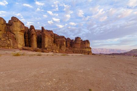 View of landscape and the Solomon Pillars rock formation, in the Timna Valley, Arava desert,...