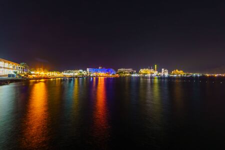 Night view of the coastline, promenade and hotels in Eilat, southernmost city in Israelの写真素材