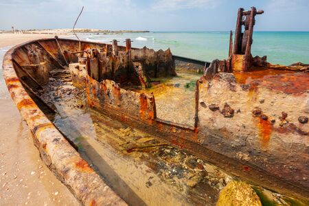 View of a Rusty shipwreck on the beach. Habonim shore, Israelの写真素材