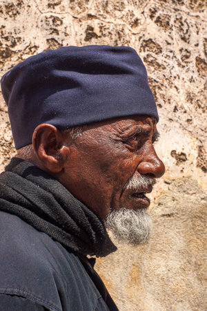 Jerusalem, Israel - April 23, 2010: Portrait of a monk of the Ethiopian Orthodox Tewahedo Church, in the Church of the Holy Sepulchre, Old City, Jerusalem, Israelのeditorial素材