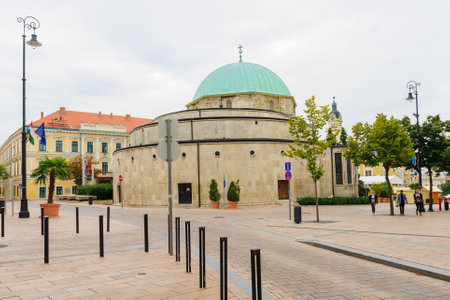 Pecs, Hungary - September 28, 2013: View of the historic mosque building, with locals and visitors, in Pecs, Hungaryのeditorial素材