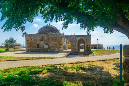 Achziv, Israel - July 22, 2020: View of an old mosque building, with visitors, in Achziv national park, northern Israelのeditorial素材