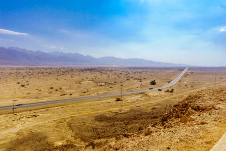 View of the Arava desert landscape, and the Arava road (90), between Israel and Jordanの写真素材