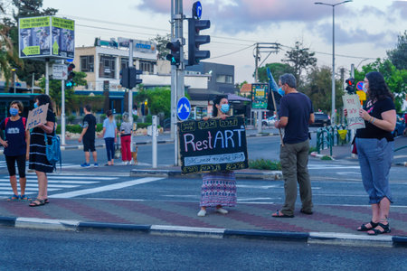 Haifa, Israel - September 26, 2020: People protest against the government, Bibi Netanyahu, and the recent lock-down, in Ziv center, Haifa, Israelのeditorial素材