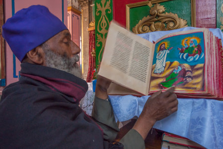 Jerusalem, Israel - April 23, 2010: A monk showing a holy book in the Ethiopian Church on Ethiopia...