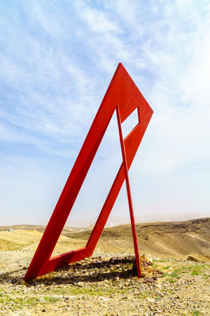 Arad, Israel - March 11, 2021: The Gate to the Desert sculpture, and Judaean desert landscape, with Arad Observatory sculpture in the background, in Arad, Southern Israelのeditorial素材