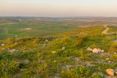 Sunset view of countryside and rural landscape from the Gaat hill, near Lahav, in the Negev Desert, Southern Israelの写真素材