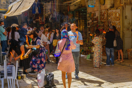Jerusalem, Israel - May 01, 2021: Pilgrims passing on the Holy Fire, on Holy Saturday (Easter), in...