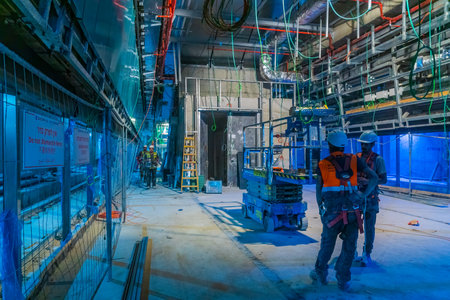 Tel-Aviv, Israel - June 17, 2021: View of subway station construction site, with workers, in Tel-Aviv, Israelのeditorial素材