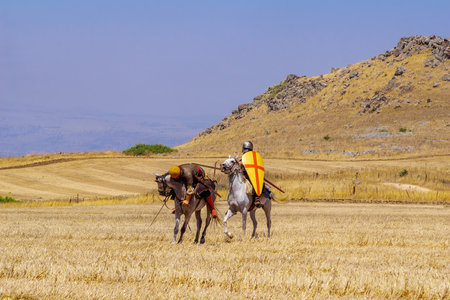 Lavi, Israel - July 02, 2021: Re-enactment of the 1187 Battle of the Horns of Hattin (Ayyubid sultan Saladin defeated the crusaders): Cavalry fight. Horns of Hattin, Israelのeditorial素材