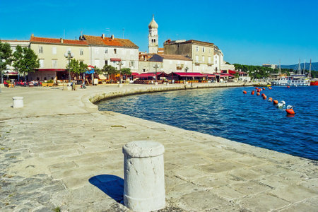 Krk, Croatia - October 08, 2006: Scene of the port, with local businesses, locals and visitors, in Krk, Krk Island, Croatiaのeditorial素材