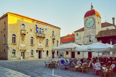Trogir, Croatia - October 06, 2006: Scene of the central square, with the clock tower, locals and visitors, in Trogir, Croatiaのeditorial素材