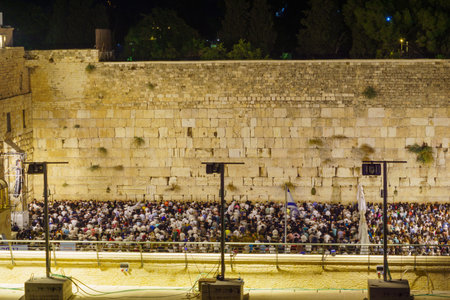 Jerusalem, Israel - August 31, 2021: Crowd of Jewish prayers attend a mass Selichot, Jewish penitential prays, at the Western Wall, Old City of Jerusalem, Israelのeditorial素材