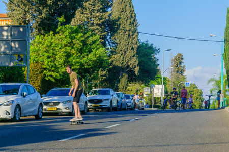 Haifa, Israel - September 16, 2021: Scene of Yom Kippur Holiday, with streets free from moving cars, and filled with skaters and cyclists. Haifa, Israelのeditorial素材